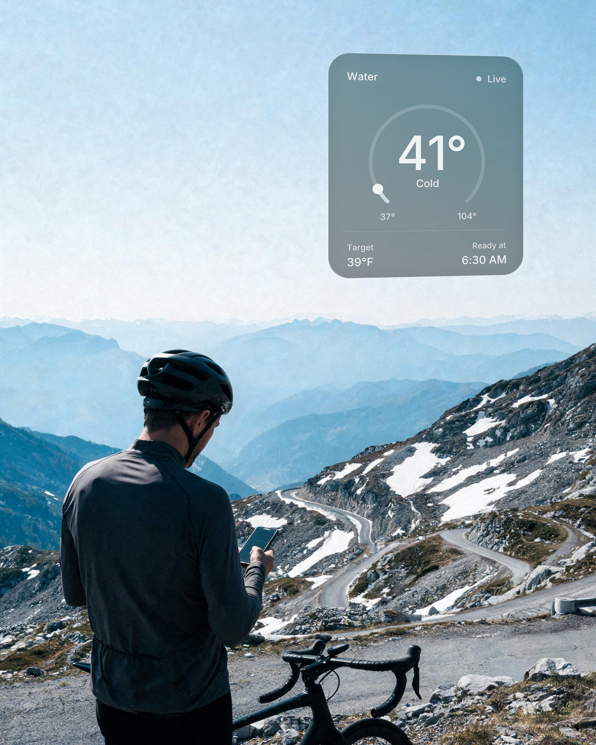 A cyclist on a mountain pass checks the water on his phone: 41°F, target 39°F, ready at 6:30 AM