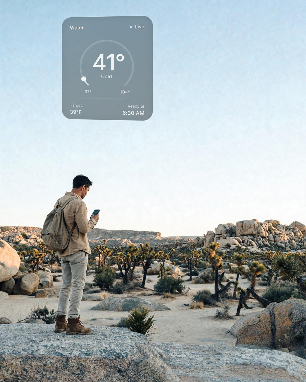 A hiker among Joshua trees at sunrise checks the water of his hot and cold vessel at home on his phone: 41°F, ready at 6:30 AM