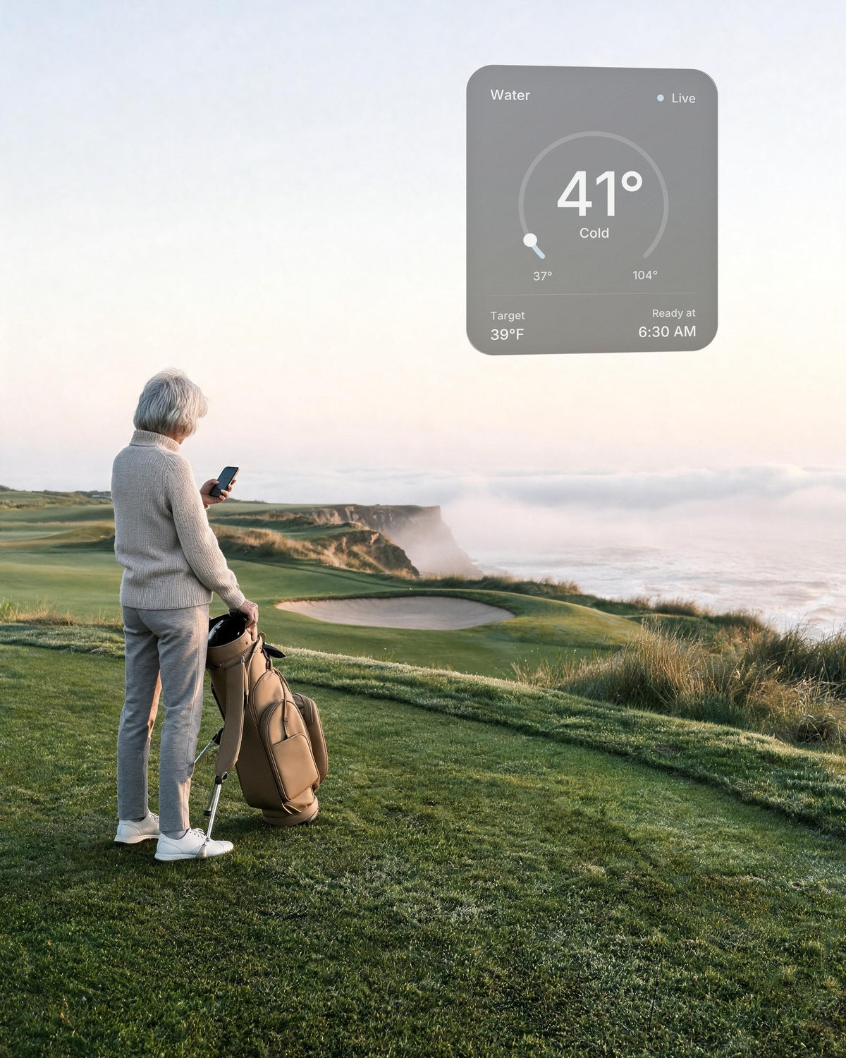 A woman on a links course above the Oregon coast at dawn checks the water of her hot and cold vessel at home on her phone: 41°F, ready at 6:30 AM
