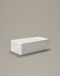 BLOCK rectangular vessel in white acrylic, three-quarter view, on a warm grey studio background