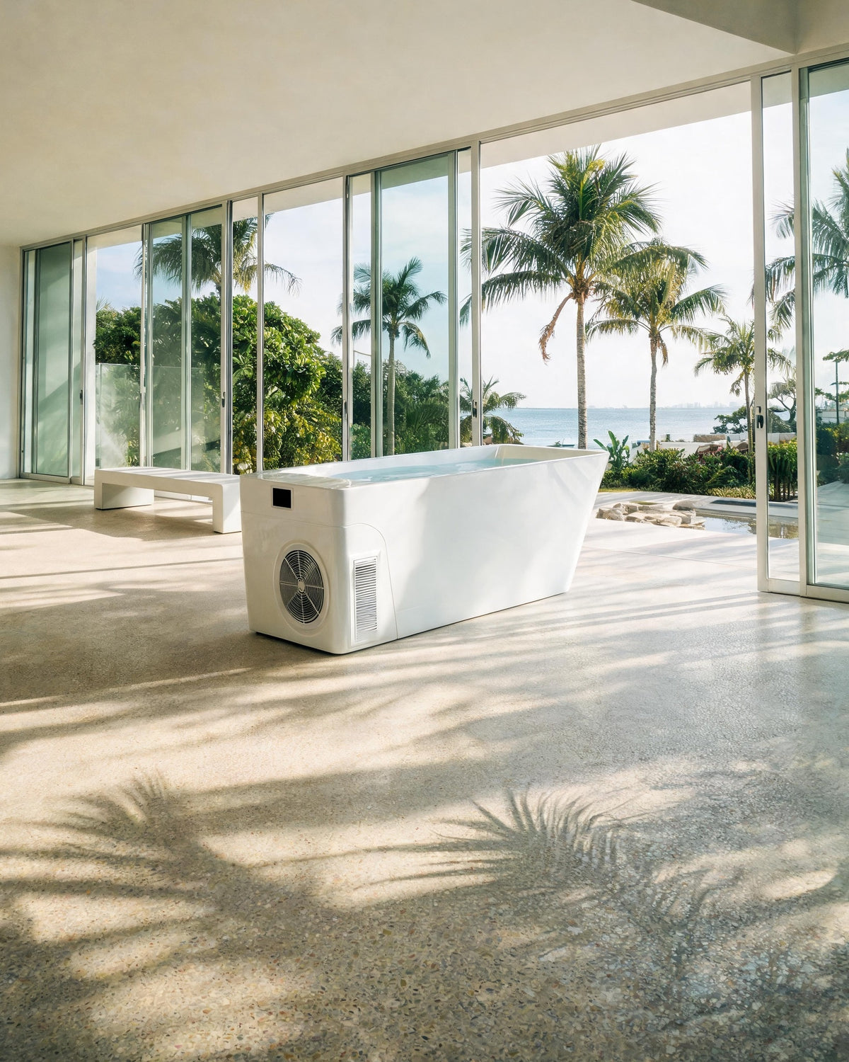 MONOLITH vessel with its built-in Hot & Cold Unit in a sunlit pavilion open onto palms and the bay