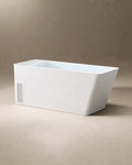 MONOLITH vessel in white acrylic with its Hot & Cold Unit built into one end, three-quarter view on a warm grey studio background