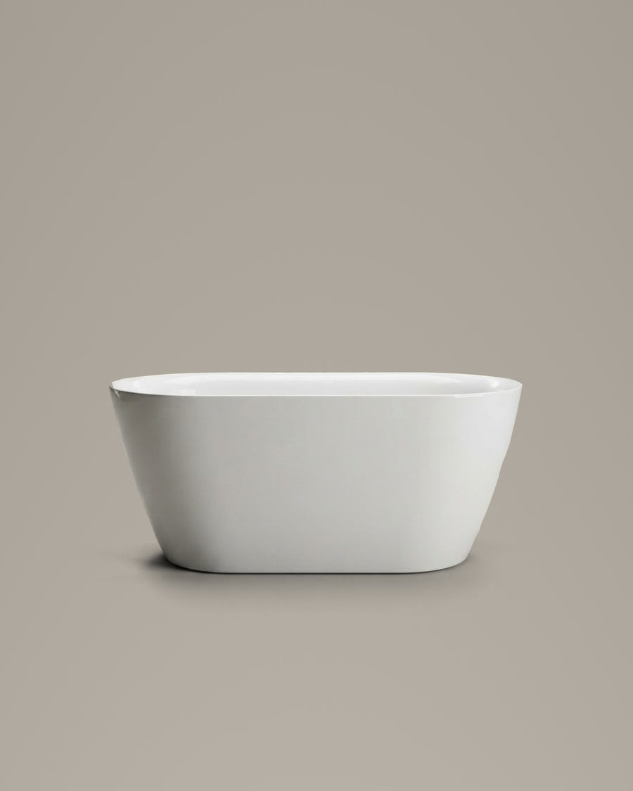 NOOK compact vessel in white acrylic, side view, on a warm grey studio background