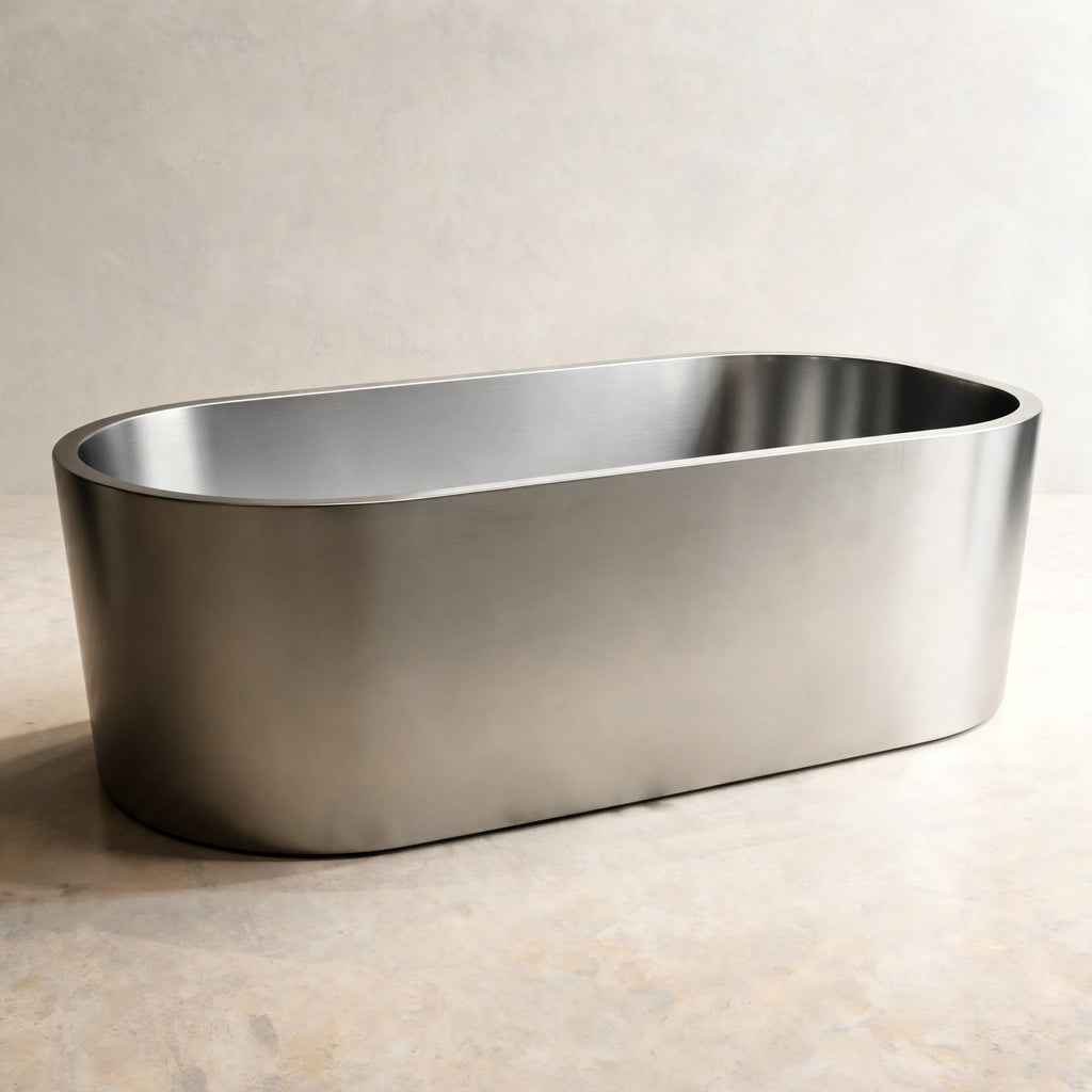 OBLONG hot and cold vessel, an oval in Satin Steel, on a pale stone floor
