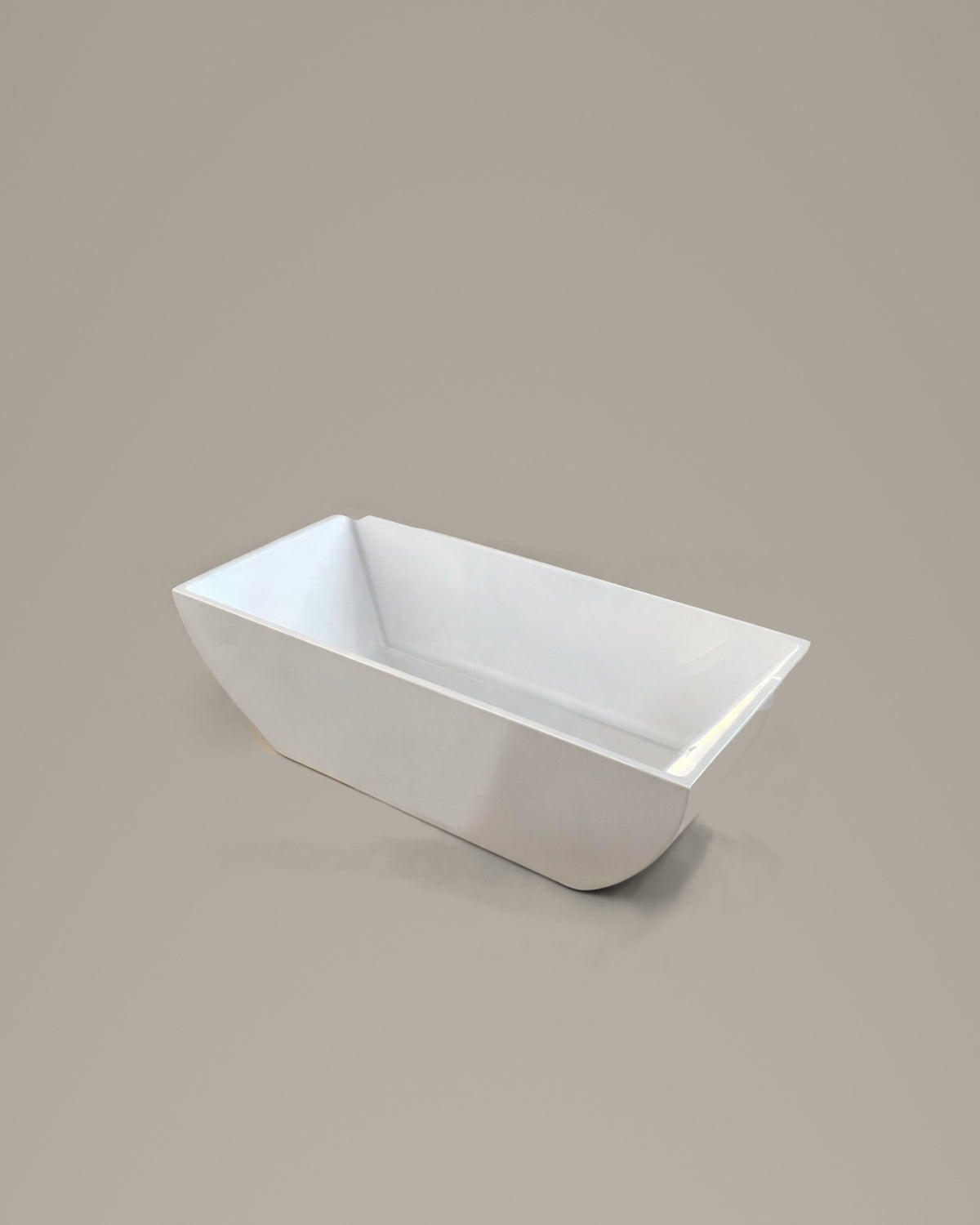 PRISM faceted vessel in white acrylic, three-quarter view, on a warm grey studio background